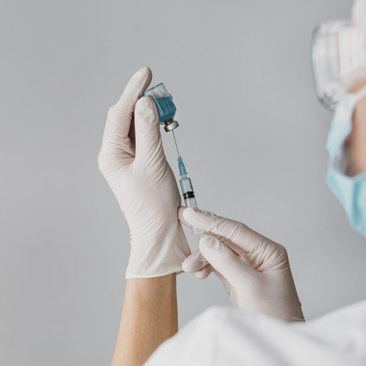 doctor-holding-syringe-vaccine